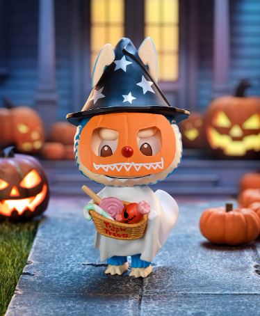 POP MART Labubu Trick-or-Treater collectible figure wearing a pumpkin mask and wizard hat holding a candy basket outdoors