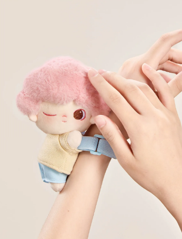POP MART Dimoo Cloud Companion series figurine with pink hair and blue outfit worn on wrist