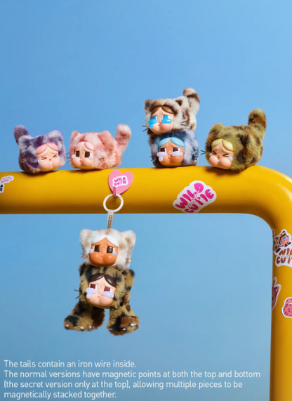 POP MART CRYBABY blind box pendant plush figures in cat costumes hanging and sitting on yellow bar