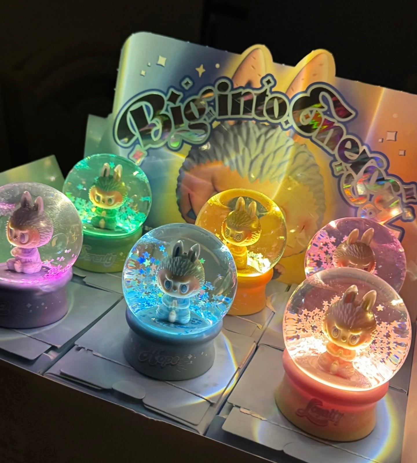 POP MART Labubu crystal ball preorder featuring six colorful snow globes with glowing bunny figures inside