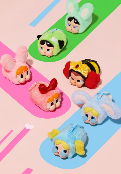 POP MART vinyl Powerpuff Girls plush figures dressed in colorful animal costumes on a pastel background