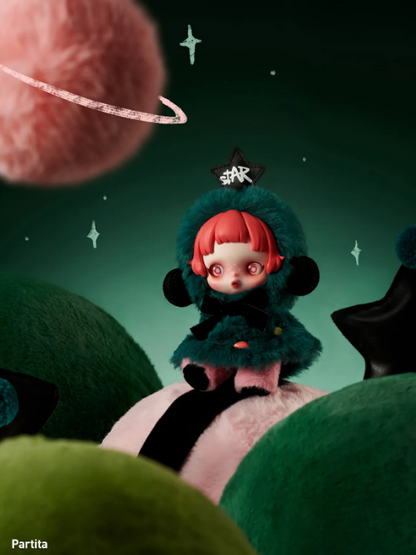 POP MART Skullpanda Winter Symphony plush doll with red hair and teal outfit sitting on a soft surface